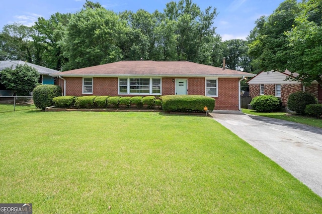 135 5th Ave, Jonesboro, GA 30236 - ranch-style home featuring brick siding and driveway