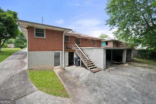 135 5th Ave, Jonesboro, GA 30236 - rear view of house with brick siding and stairs