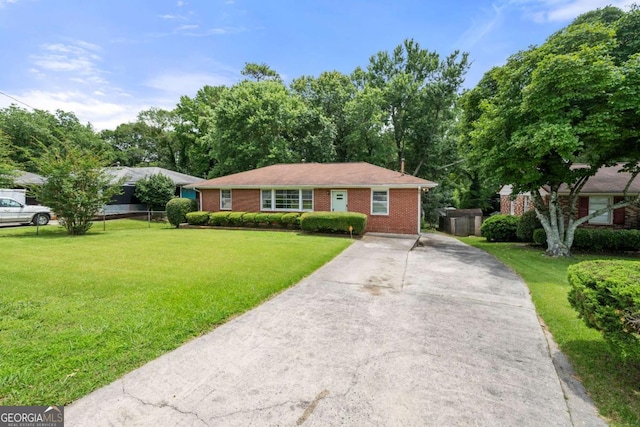 135 5th Ave, Jonesboro, GA 30236 - single story home featuring a front yard, driveway, and brick siding
