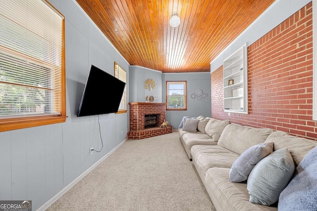 135 5th Ave, Jonesboro, GA 30236 - living room with wood ceiling, carpet flooring, a brick fireplace, wooden walls, and brick wall