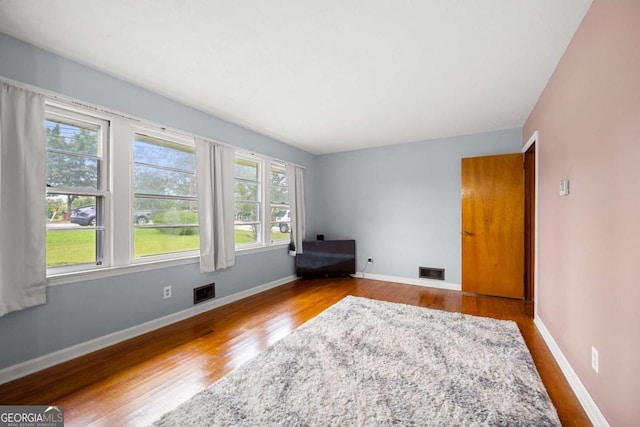 135 5th Ave, Jonesboro, GA 30236 - spare room featuring wood finished floors and baseboards