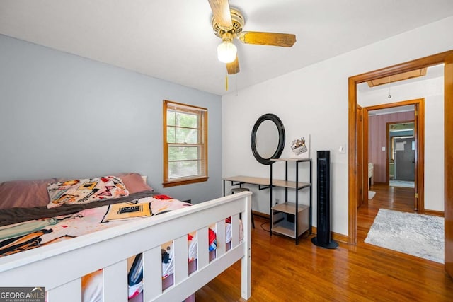 135 5th Ave, Jonesboro, GA 30236 - bedroom with attic access, wood finished floors, and ceiling fan