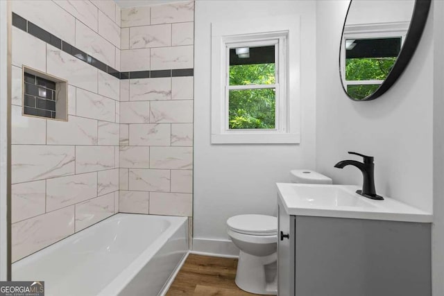 1400 N Ave NW, Atlanta, GA 30318 - bathroom featuring vanity, wood finished floors, and washtub / shower combination