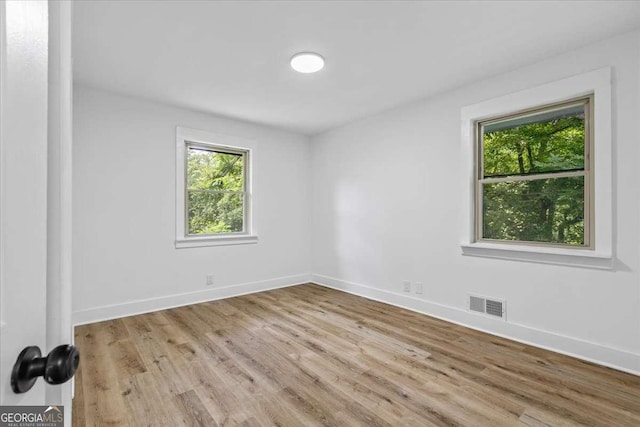 1400 N Ave NW, Atlanta, GA 30318 - empty room featuring wood finished floors
