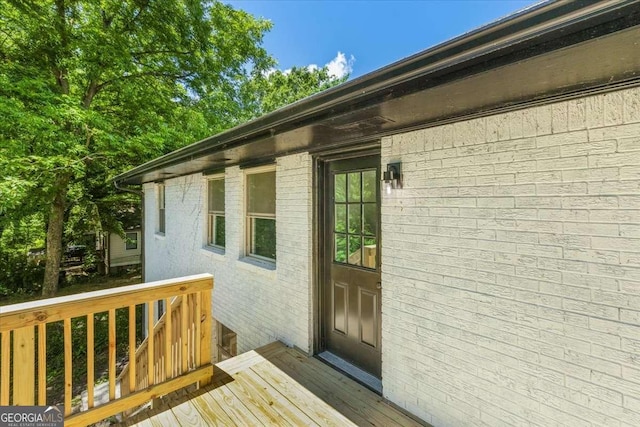 1400 N Ave NW, Atlanta, GA 30318 - view of exterior entry with a wooden deck and brick siding