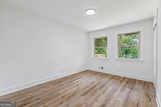 1400 N Ave NW, Atlanta, GA 30318 - spare room featuring light wood-style floors and baseboards