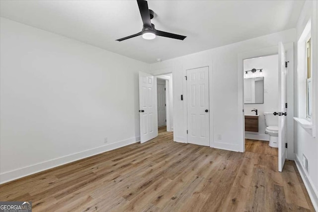 1400 N Ave NW, Atlanta, GA 30318 - unfurnished bedroom featuring light wood finished floors, ensuite bathroom, and a ceiling fan