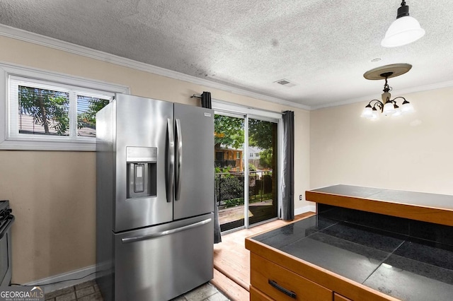 115 Biscayne Dr NW Unit E3, Atlanta, GA 30309 - kitchen featuring stainless steel refrigerator with ice dispenser, ornamental molding, a textured ceiling, a chandelier, and decorative light fixtures