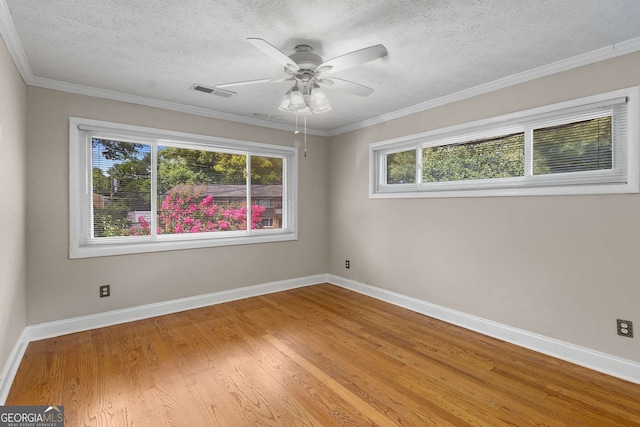 115 Biscayne Dr NW Unit E3, Atlanta, GA 30309 - spare room with a textured ceiling, wood finished floors, a ceiling fan, and crown molding