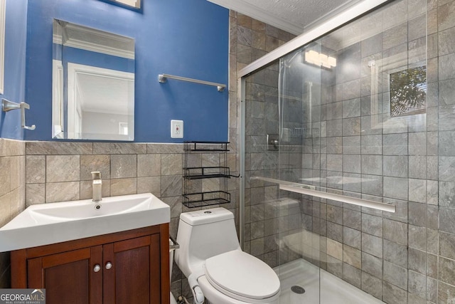 115 Biscayne Dr NW Unit E3, Atlanta, GA 30309 - bathroom with ornamental molding, vanity, tile walls, a shower stall, and wainscoting