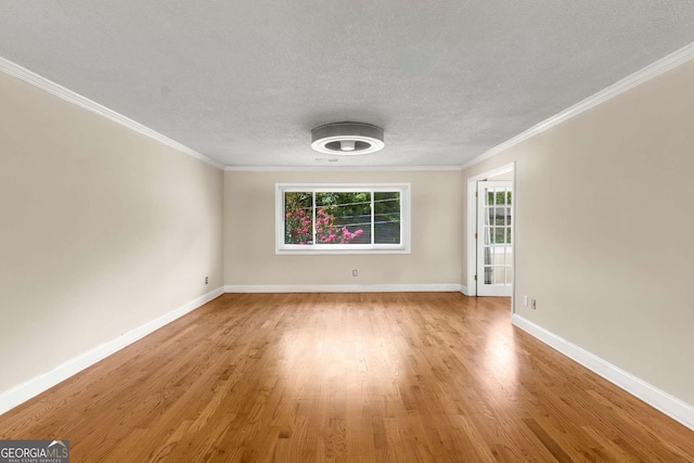 115 Biscayne Dr NW Unit E3, Atlanta, GA 30309 - unfurnished room with wood finished floors, ornamental molding, and a textured ceiling
