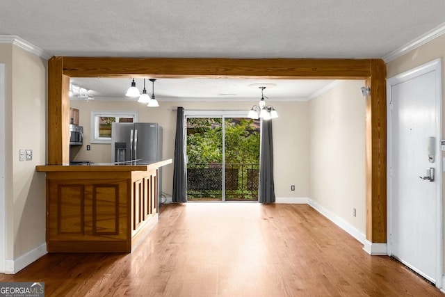 115 Biscayne Dr NW Unit E3, Atlanta, GA 30309 - unfurnished living room featuring crown molding, wood finished floors, and a chandelier