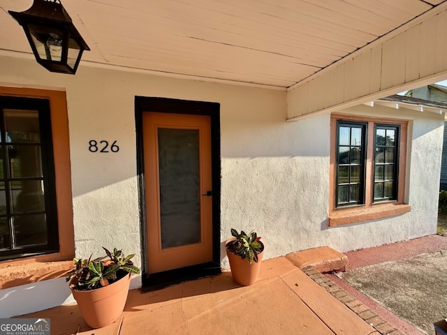 826 W Grenada Ter, Macon, GA 31206 - doorway to property with stucco siding