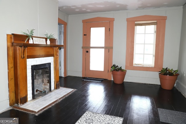 826 W Grenada Ter, Macon, GA 31206 - living area with wood-type flooring and a tiled fireplace