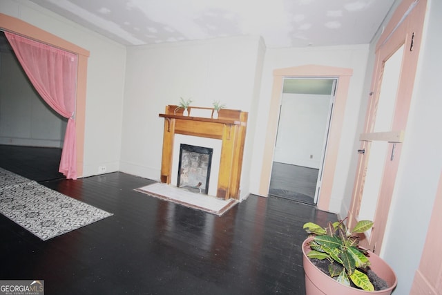 826 W Grenada Ter, Macon, GA 31206 - unfurnished living room featuring a fireplace and wood finished floors