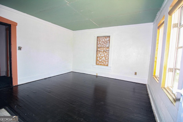 826 W Grenada Ter, Macon, GA 31206 - spare room featuring dark wood-style floors and baseboards