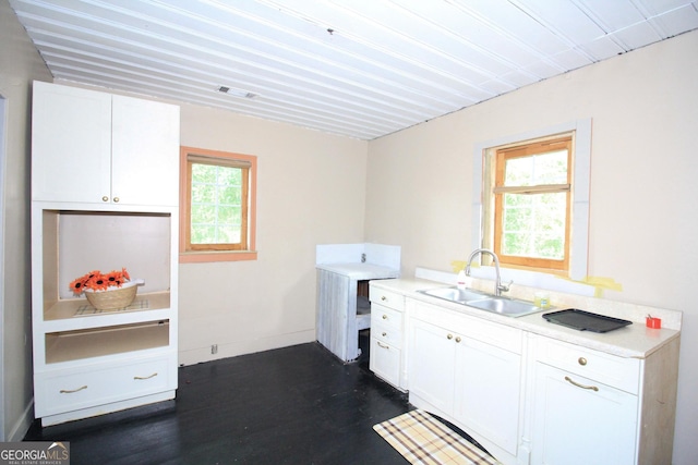 826 W Grenada Ter, Macon, GA 31206 - laundry room featuring a sink and dark wood-style floors