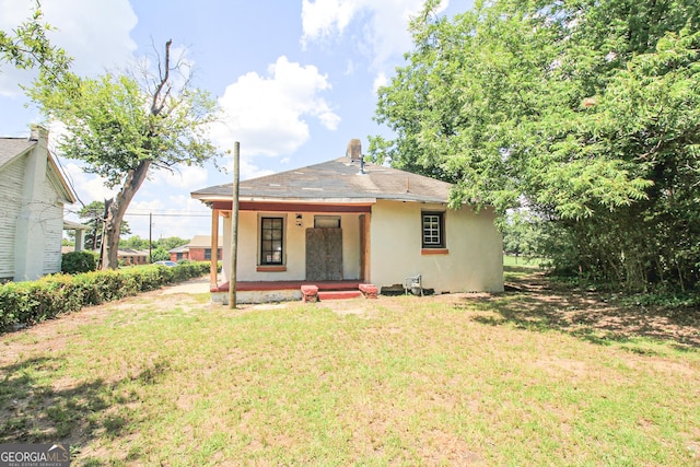 826 W Grenada Ter, Macon, GA 31206 - view of front of property featuring a porch, a front lawn, and stucco siding