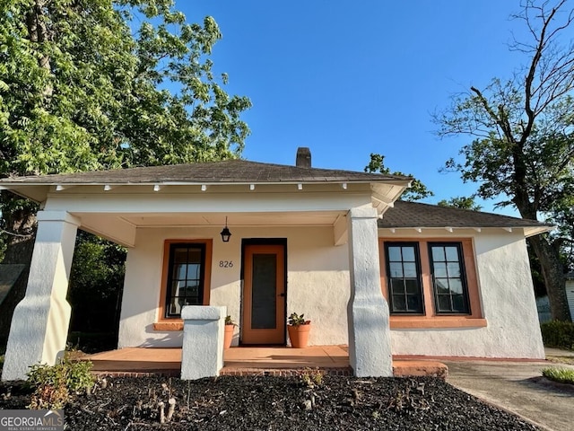 826 W Grenada Ter, Macon, GA 31206 - bungalow-style house with stucco siding and covered porch