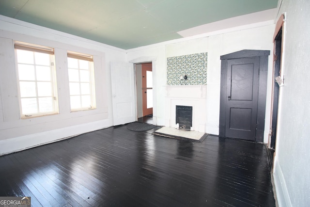826 W Grenada Ter, Macon, GA 31206 - unfurnished living room featuring a fireplace and hardwood / wood-style flooring
