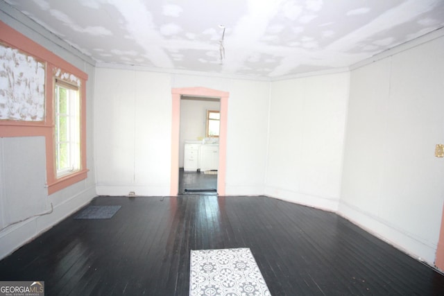 826 W Grenada Ter, Macon, GA 31206 - spare room with wood-type flooring and baseboards