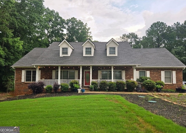 79 The Farm Rd, Mcdonough, GA 30252 - new england style home with brick siding, covered porch, and a front yard