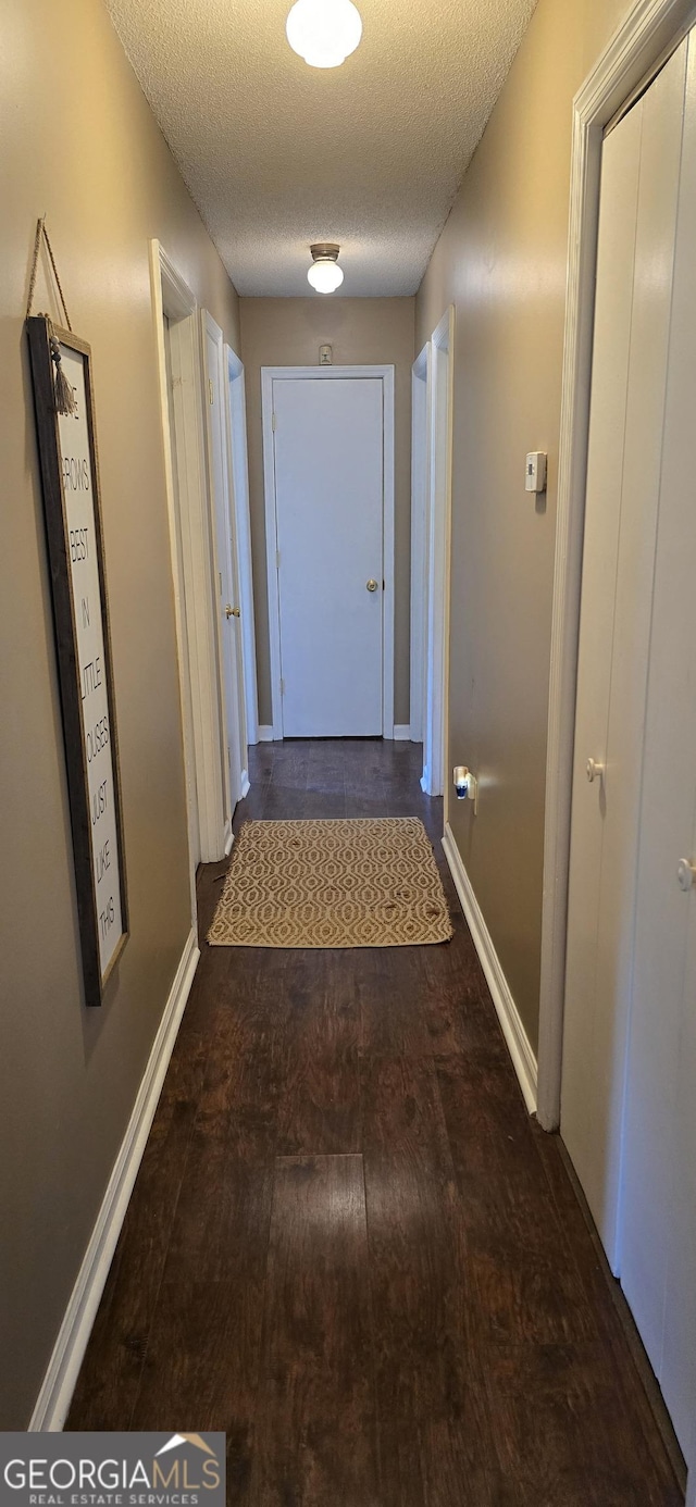 467 Witherington Cir, East Dublin, GA 31027 - hall featuring a textured ceiling and wood finished floors