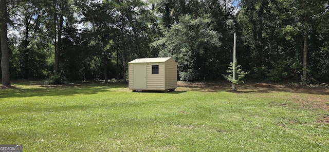 467 Witherington Cir, East Dublin, GA 31027 - view of green lawn featuring a storage shed