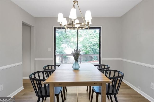 410 Sheringham Ct, Roswell, GA 30076 - dining room featuring a chandelier and wood finished floors