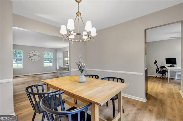 410 Sheringham Ct, Roswell, GA 30076 - dining area with light wood-type flooring, a desk, and a chandelier