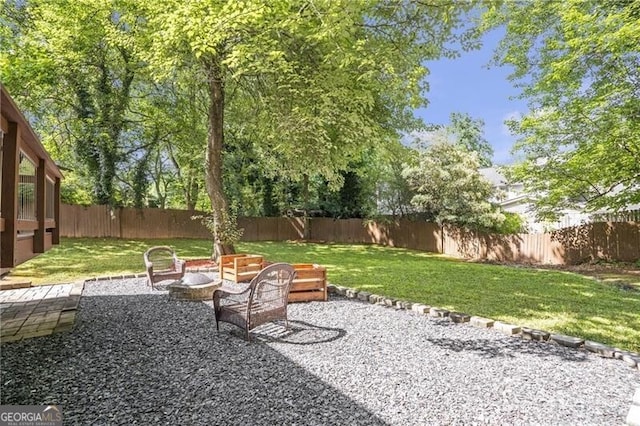 410 Sheringham Ct, Roswell, GA 30076 - fenced backyard featuring a fire pit and a patio
