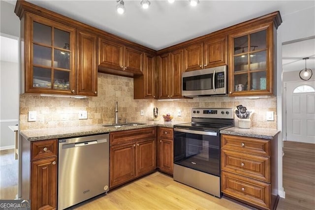 410 Sheringham Ct, Roswell, GA 30076 - kitchen with appliances with stainless steel finishes, light wood finished floors, and light stone counters