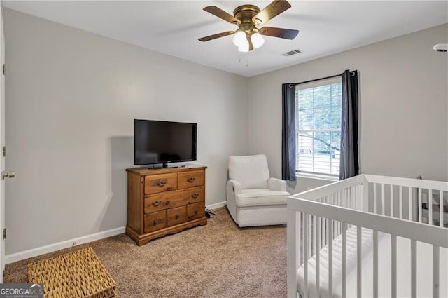 410 Sheringham Ct, Roswell, GA 30076 - carpeted bedroom featuring a crib and a ceiling fan