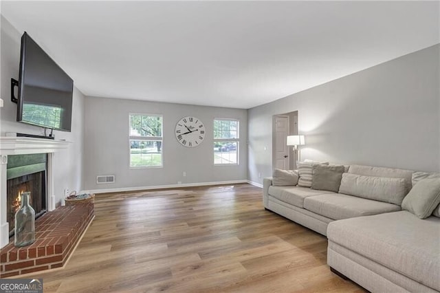410 Sheringham Ct, Roswell, GA 30076 - living room featuring a fireplace and wood finished floors