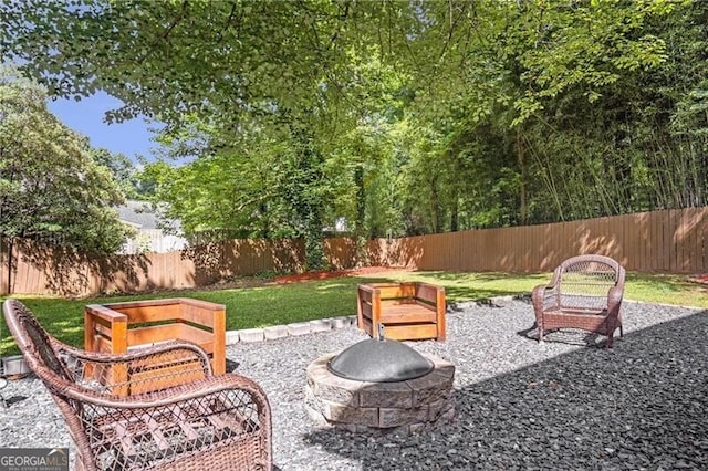 410 Sheringham Ct, Roswell, GA 30076 - fenced backyard featuring a fire pit