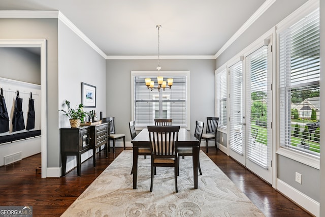 2470 Green Mountain Dr, Braselton, GA 30517 - dining area featuring a chandelier, dark wood finished floors, and ornamental molding