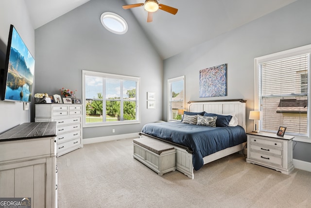 2470 Green Mountain Dr, Braselton, GA 30517 - bedroom with high vaulted ceiling, light colored carpet, and ceiling fan