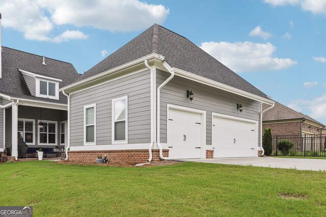 2470 Green Mountain Dr, Braselton, GA 30517 - view of side of property featuring concrete driveway, roof with shingles, and a garage