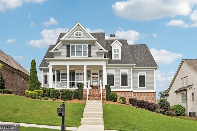 2470 Green Mountain Dr, Braselton, GA 30517 - view of front of property with a porch, a front lawn, roof with shingles, and brick siding