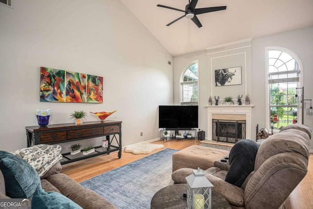 1511 Rocky Knoll Ln, Dacula, GA 30019 - living room with ceiling fan, wood finished floors, high vaulted ceiling, and a fireplace with raised hearth