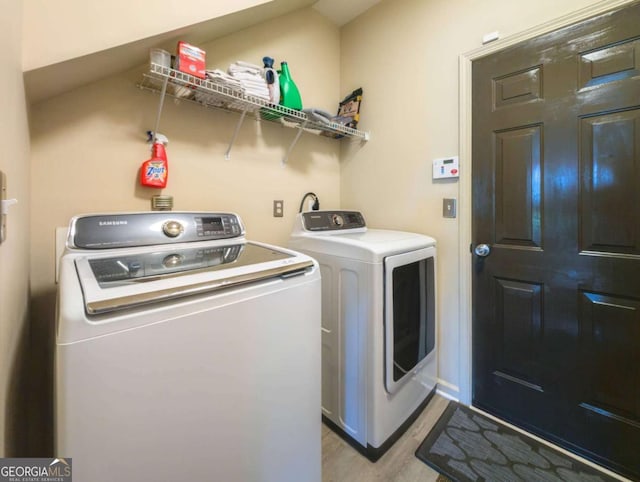 1511 Rocky Knoll Ln, Dacula, GA 30019 - laundry area featuring separate washer and dryer and light wood finished floors