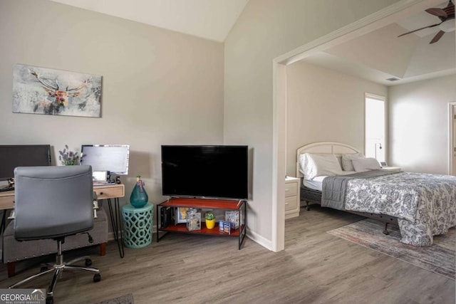 1511 Rocky Knoll Ln, Dacula, GA 30019 - bedroom featuring wood finished floors, a desk, lofted ceiling, and a ceiling fan