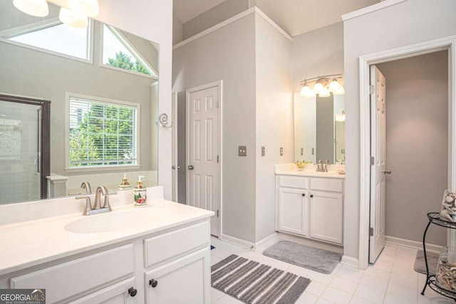 1511 Rocky Knoll Ln, Dacula, GA 30019 - full bathroom with two vanities, tile patterned floors, and a tile shower