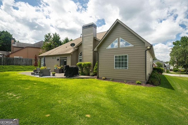 1511 Rocky Knoll Ln, Dacula, GA 30019 - rear view of house featuring a patio, a chimney, and an outdoor living space