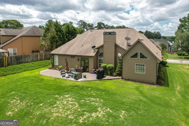 1511 Rocky Knoll Ln, Dacula, GA 30019 - back of house featuring a wooden deck and an outdoor hangout area