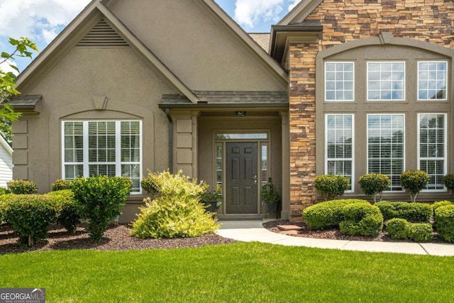 1511 Rocky Knoll Ln, Dacula, GA 30019 - entrance to property with stone siding, a yard, and stucco siding