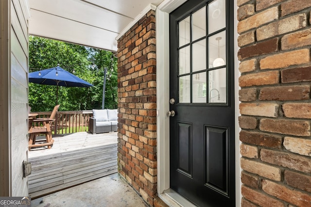 2163 Medfield Trl NE, Chamblee, GA 30345 - doorway to property featuring brick siding and a wooden deck