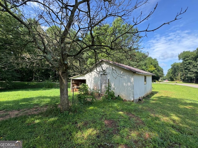 56 Harry Pauls Rd, Danielsville, GA 30633 - view of side of home featuring a yard and an outbuilding