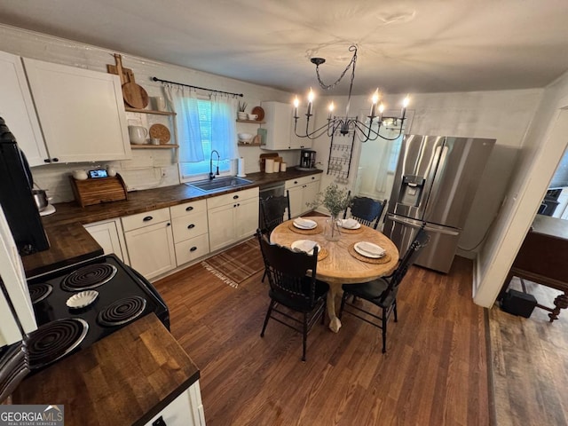 56 Harry Pauls Rd, Danielsville, GA 30633 - dining room featuring a chandelier and dark wood-style flooring