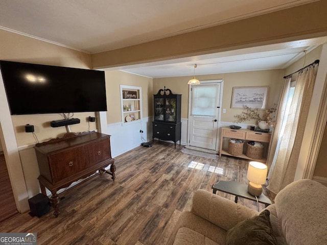 56 Harry Pauls Rd, Danielsville, GA 30633 - living area with dark wood-type flooring, built in shelves, and ornamental molding
